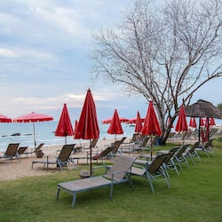 On the beach, sun loungers, beach umbrellas, beach towels