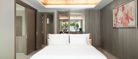 A modern bedroom with a large bed, wooden ceiling, and a large window.