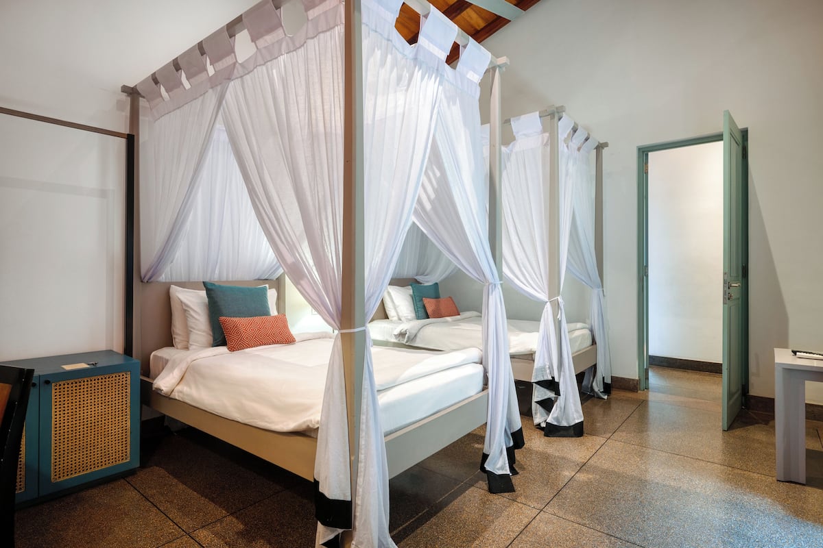 Family Suite | In-room safe, individually decorated, desk, blackout drapes