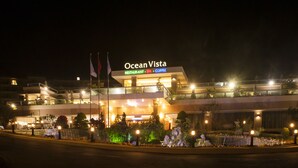 A multi-story hotel named Ocean Vista with a restaurant, spa, and coffee shop.