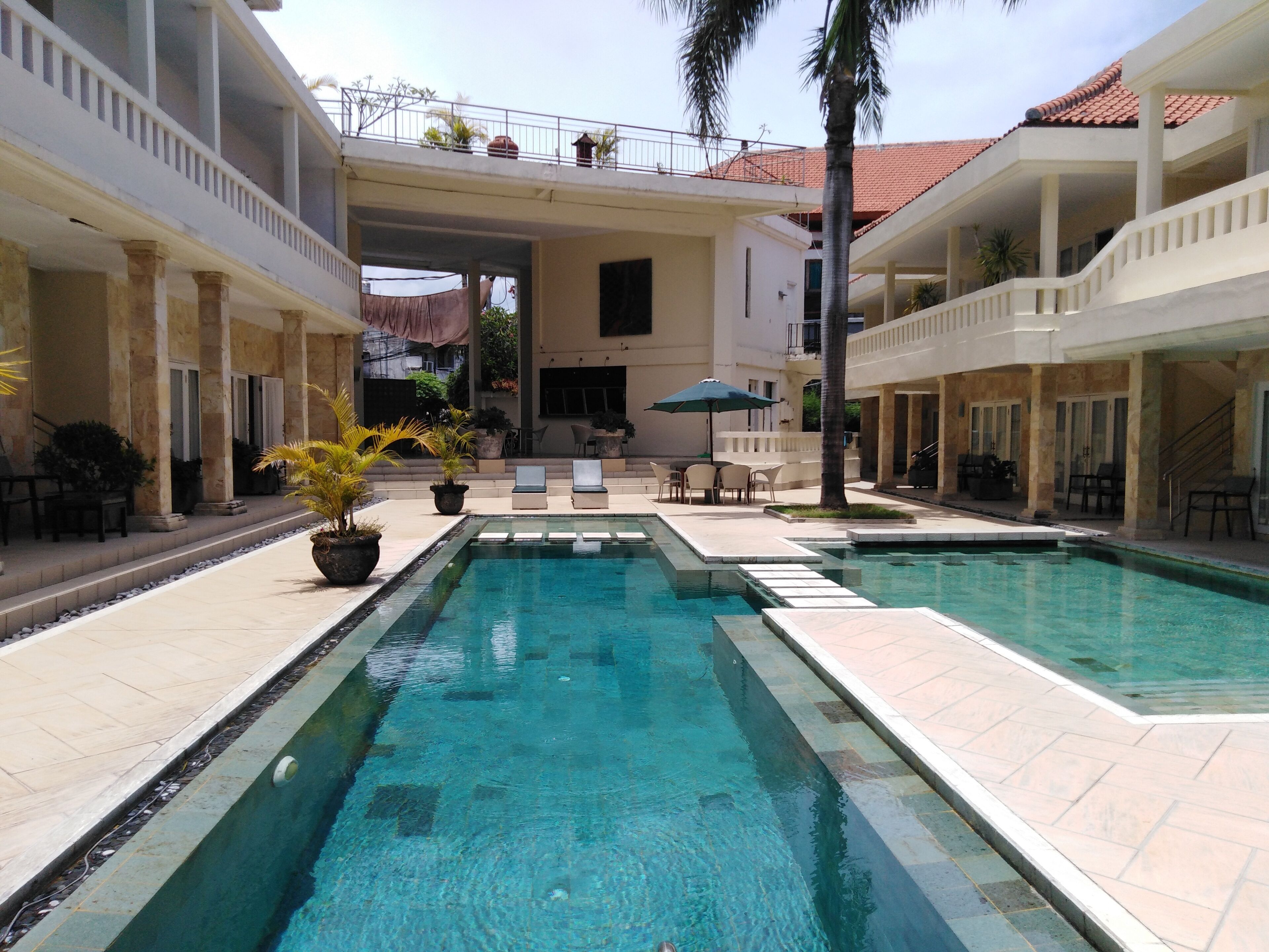 outdoor pool, pool umbrellas, pool loungers