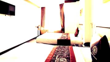 Habitación Deluxe con 2 camas individuales | Ropa de cama de alta calidad y artículos del minibar gratis