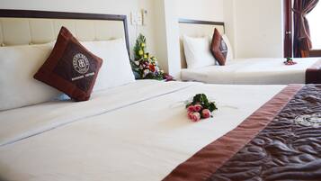 Habitación cuádruple familiar | Ropa de cama de alta calidad y artículos del minibar gratis