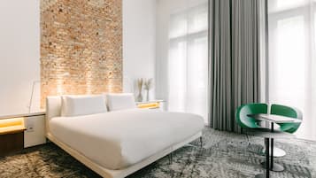 Habitación Deluxe | Ropa de cama de alta calidad y camas con efecto memoria