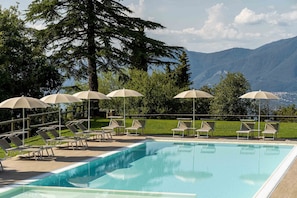 Outdoor pool, open 8:00 AM to 7:00 PM, pool umbrellas, pool loungers