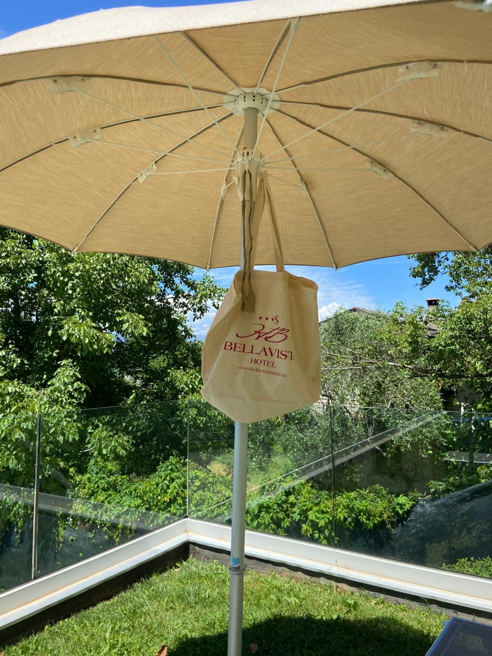 outdoor pool, open 8:00 am to 7:00 pm, pool umbrellas, pool loungers