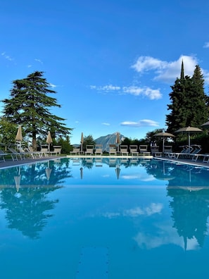 Outdoor pool, open 8:00 AM to 7:00 PM, pool umbrellas, pool loungers