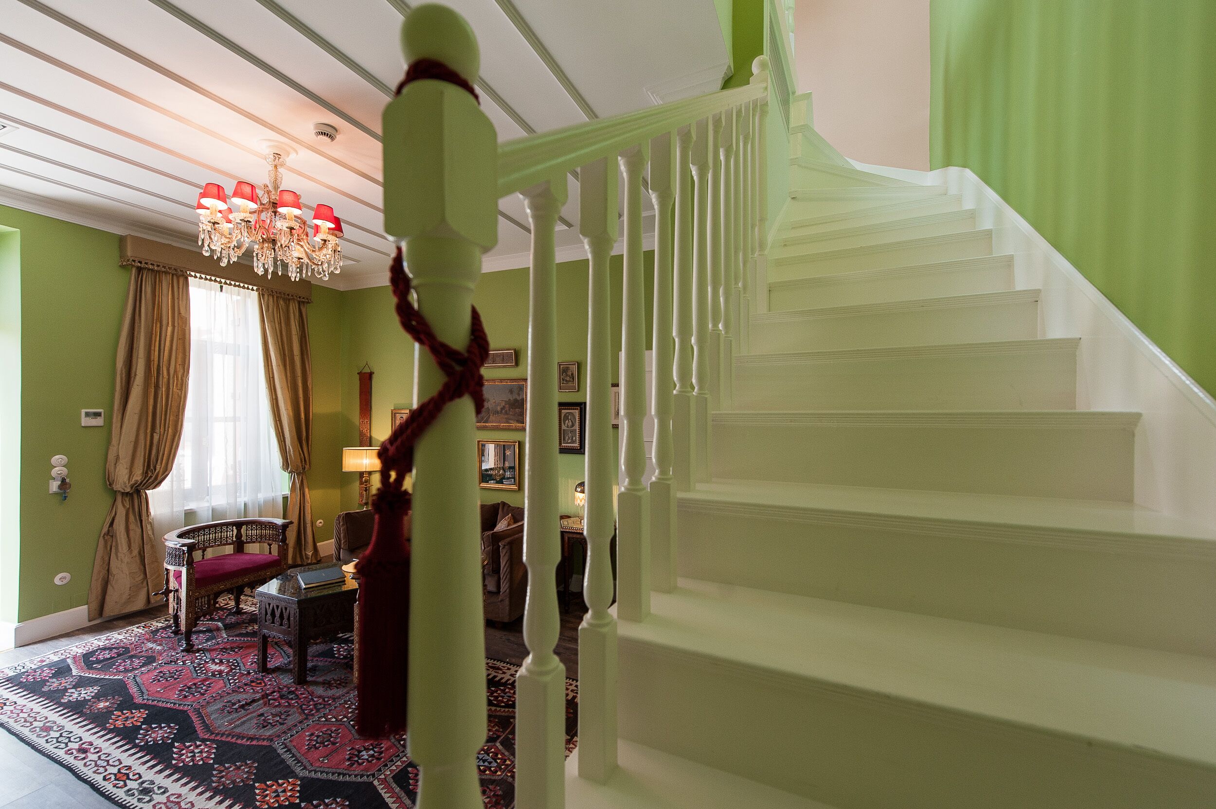 A staircase with white balusters leading to a landing.
