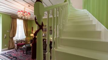 A staircase with white balusters leading to a landing.