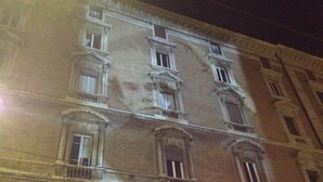 A multi-story building with classical architecture, featuring arched windows and balconies. - Albergo Panorama (Bologna)