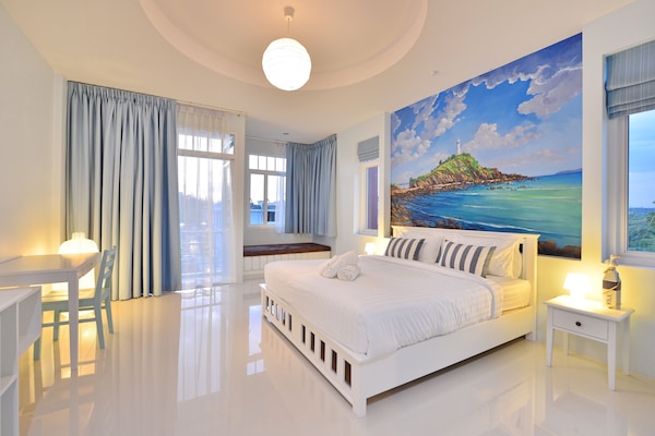 Deluxe Double Room | In-room safe, individually decorated, desk, blackout drapes