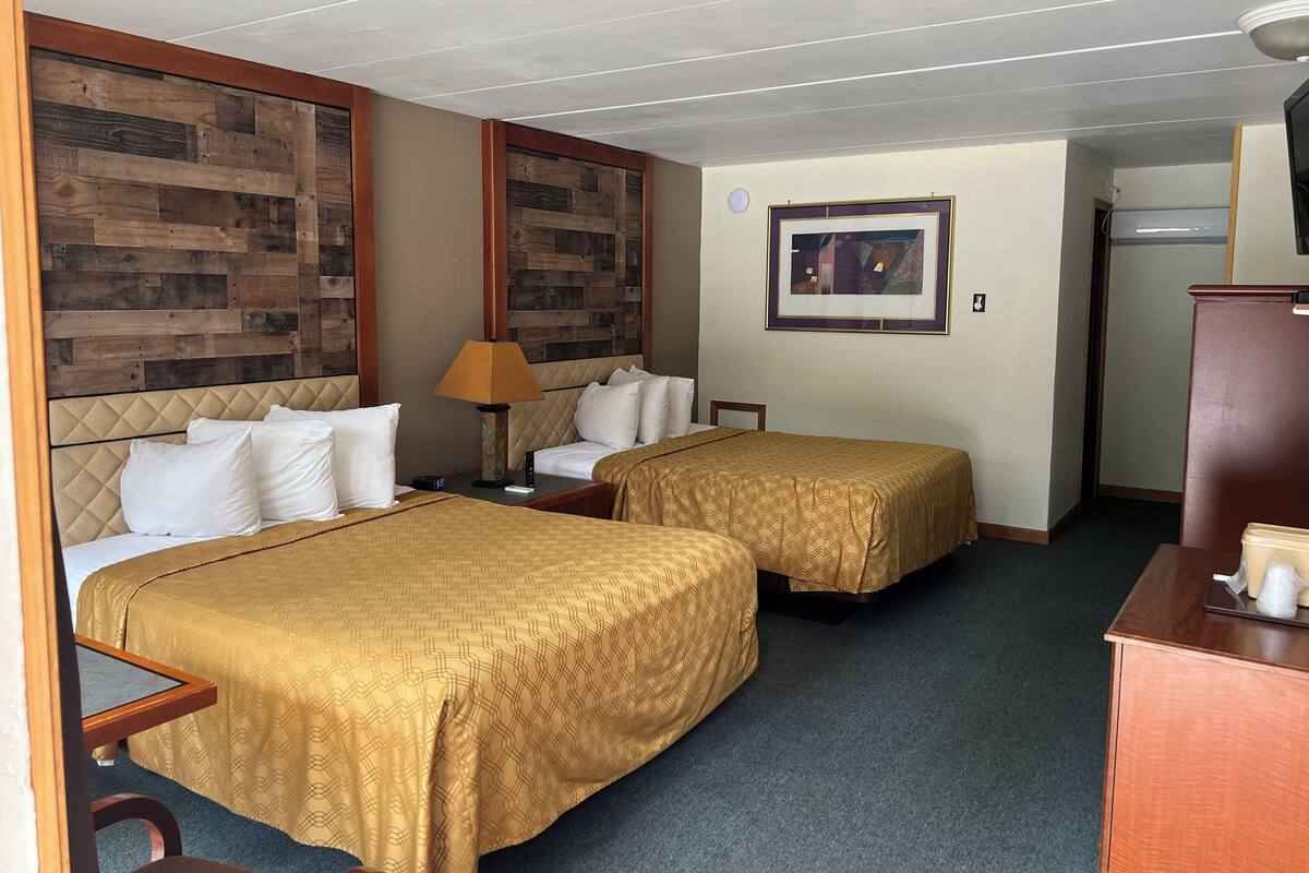 Standard Room, 2 Queen Beds, Non Smoking, Refrigerator & Microwave | Living area | 48-inch flat-screen TV with satellite channels, TV, Netflix