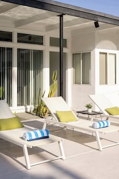 Outdoor pool, open 8:00 AM to 10:00 PM, pool umbrellas, sun loungers at The Three Fifty Hotel
