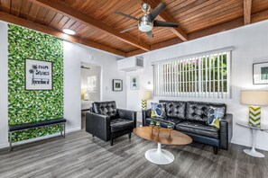 Standard Suite, 1 King Bed | Living area | TV