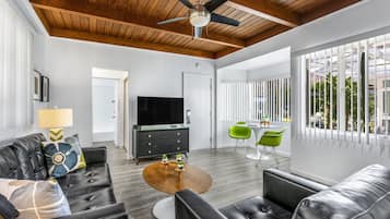 Standard Suite, 1 King Bed | Living area | TV