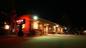 A building with a sign that reads "OFFICE" and "Wi-Fi" indicating a business establishment. - Bangor Inn & Suites (Bangor)
