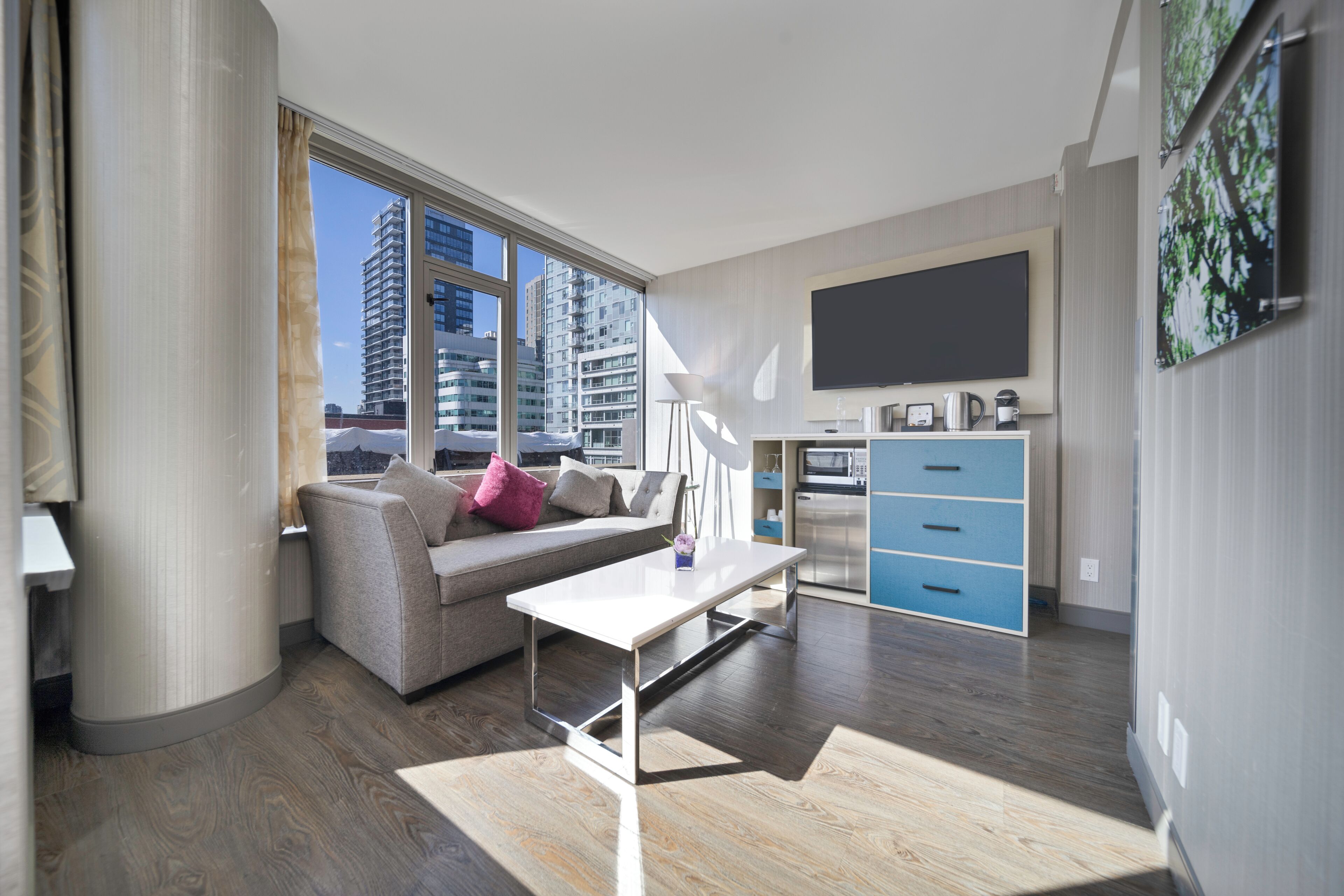 junior suite, 1 queen bed with sofa bed | living area | 55-inch smart tv with cable channels, tv