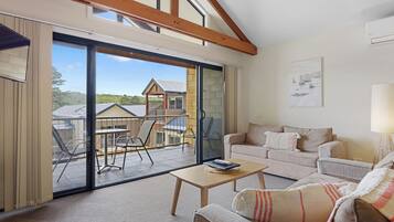 One Bedroom Spa Apartment | Living area | 32-cm flat-screen TV with cable channels, TV