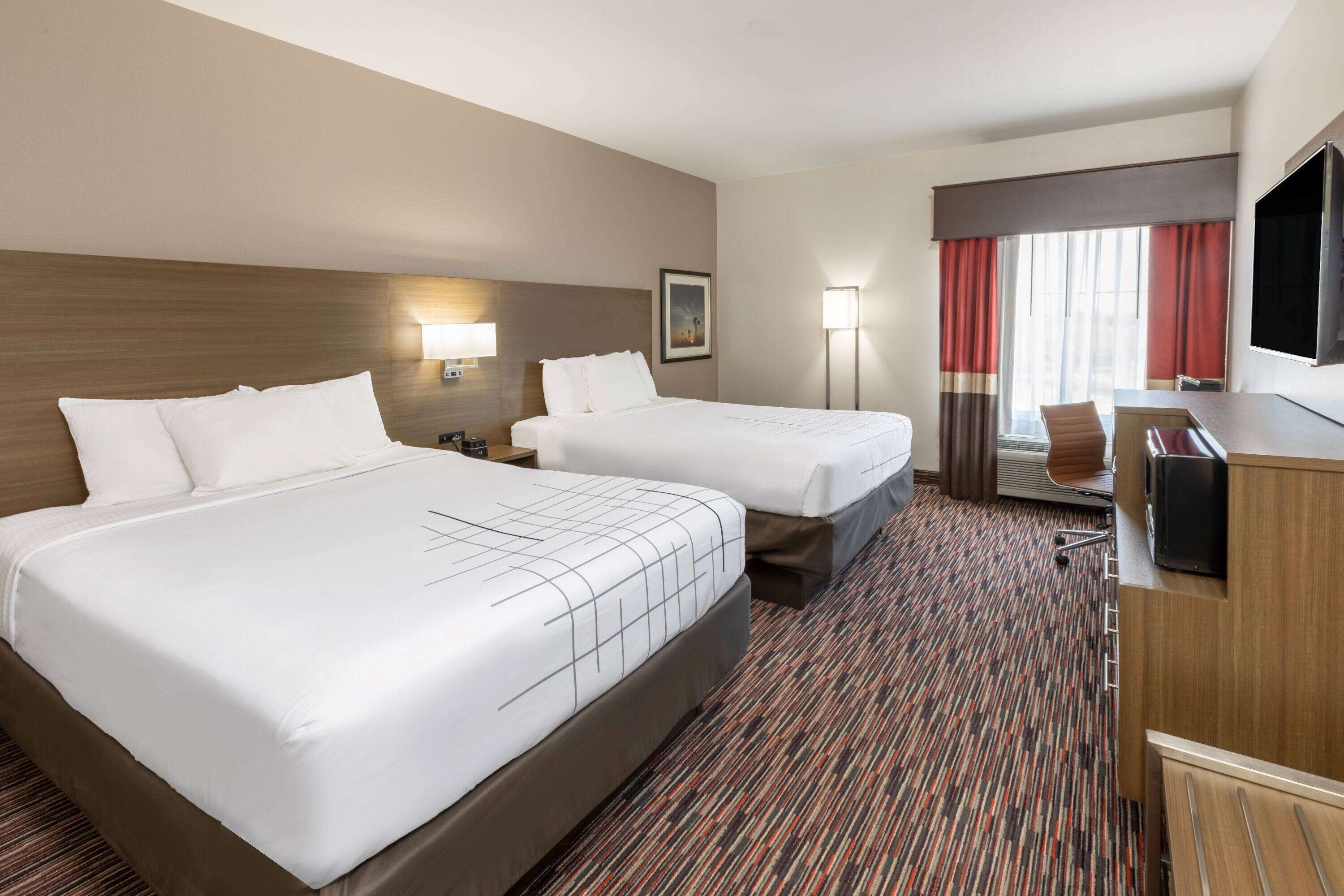 room, 2 queen beds, non smoking | premium bedding, desk, iron/ironing board, free cots/infant beds