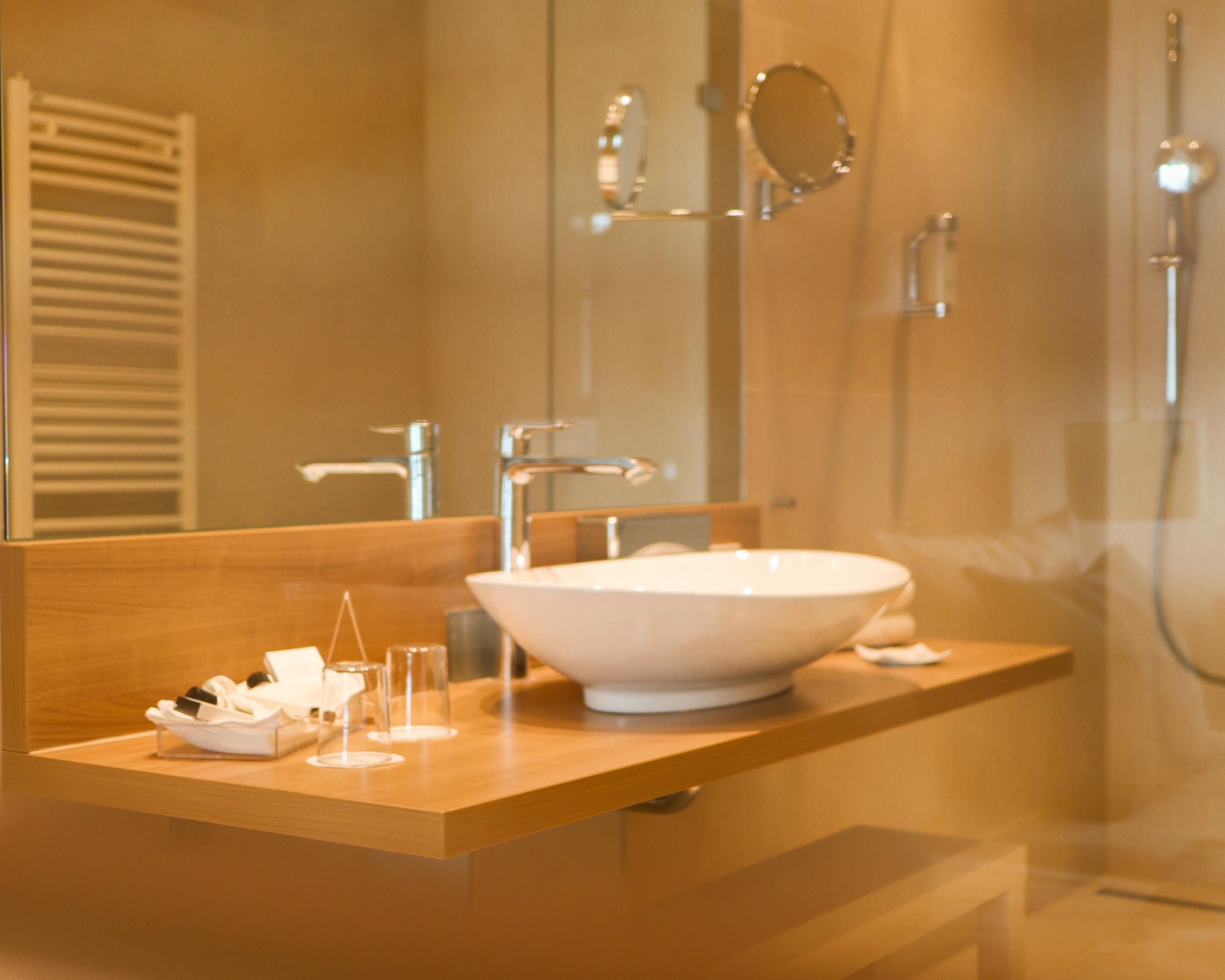 luxury double room, balcony, sea view | bathroom | shower, rainfall showerhead, hair dryer, bathrobes