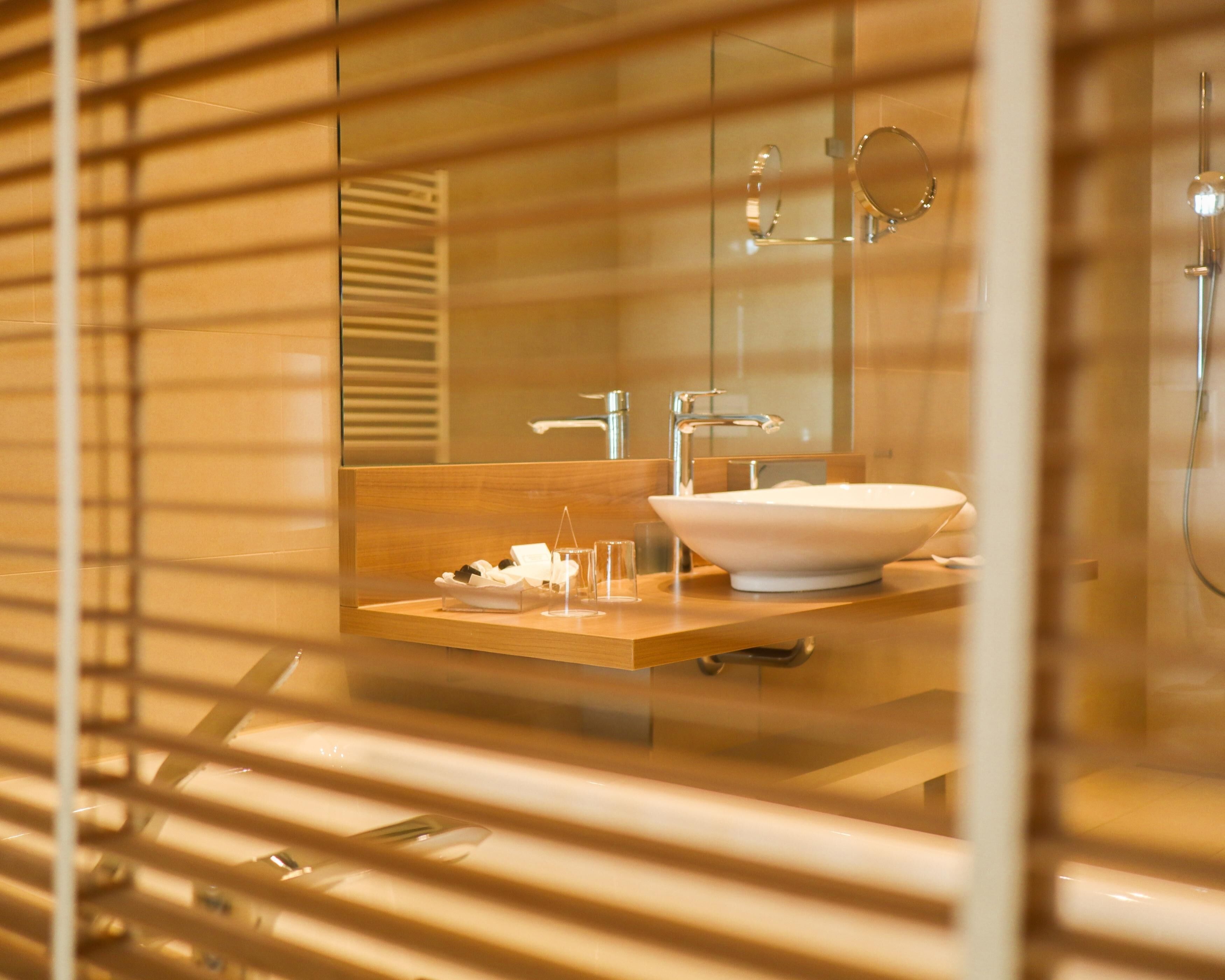 luxury room, 1 double bed, ocean view | bathroom | shower, rainfall showerhead, hair dryer, bathrobes