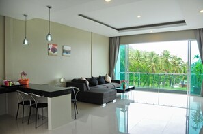 Penthouse | Living room | 32-inch LCD TV with cable channels, TV - Am Surin Place (Choeng Thale)