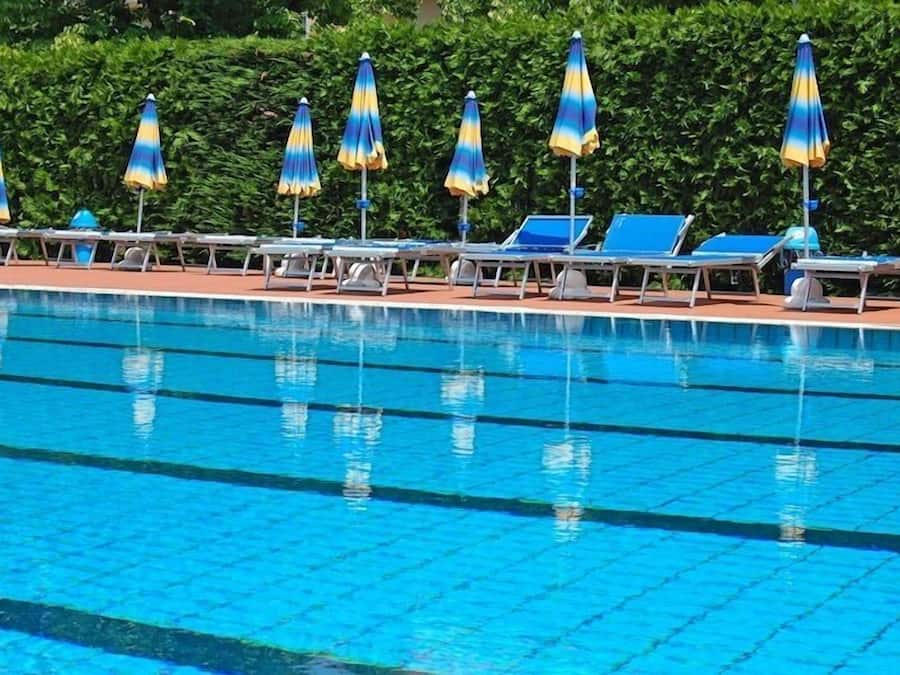Seasonal outdoor pool, pool umbrellas, pool loungers