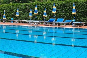 Seasonal outdoor pool, pool umbrellas, pool loungers