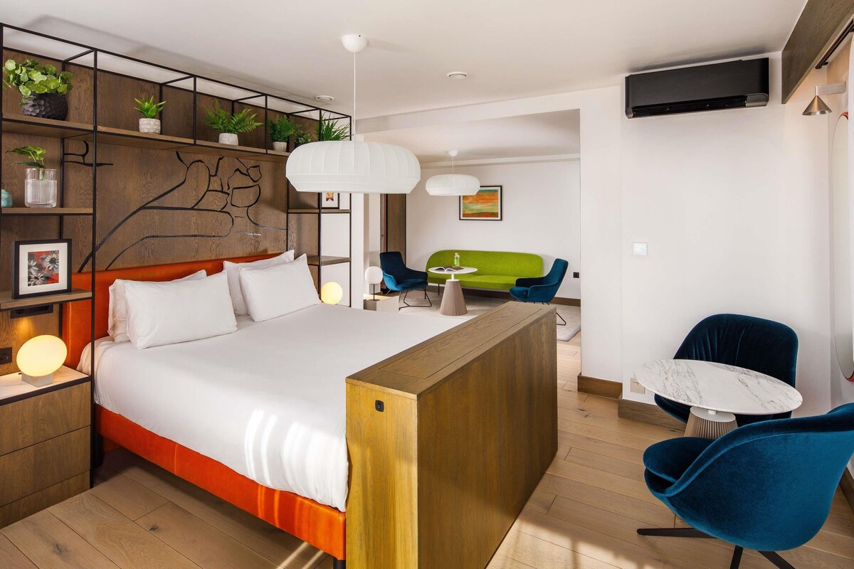 Junior Suite, 1 Double Bed, Balcony | In-room safe, desk, soundproofing, iron/ironing board