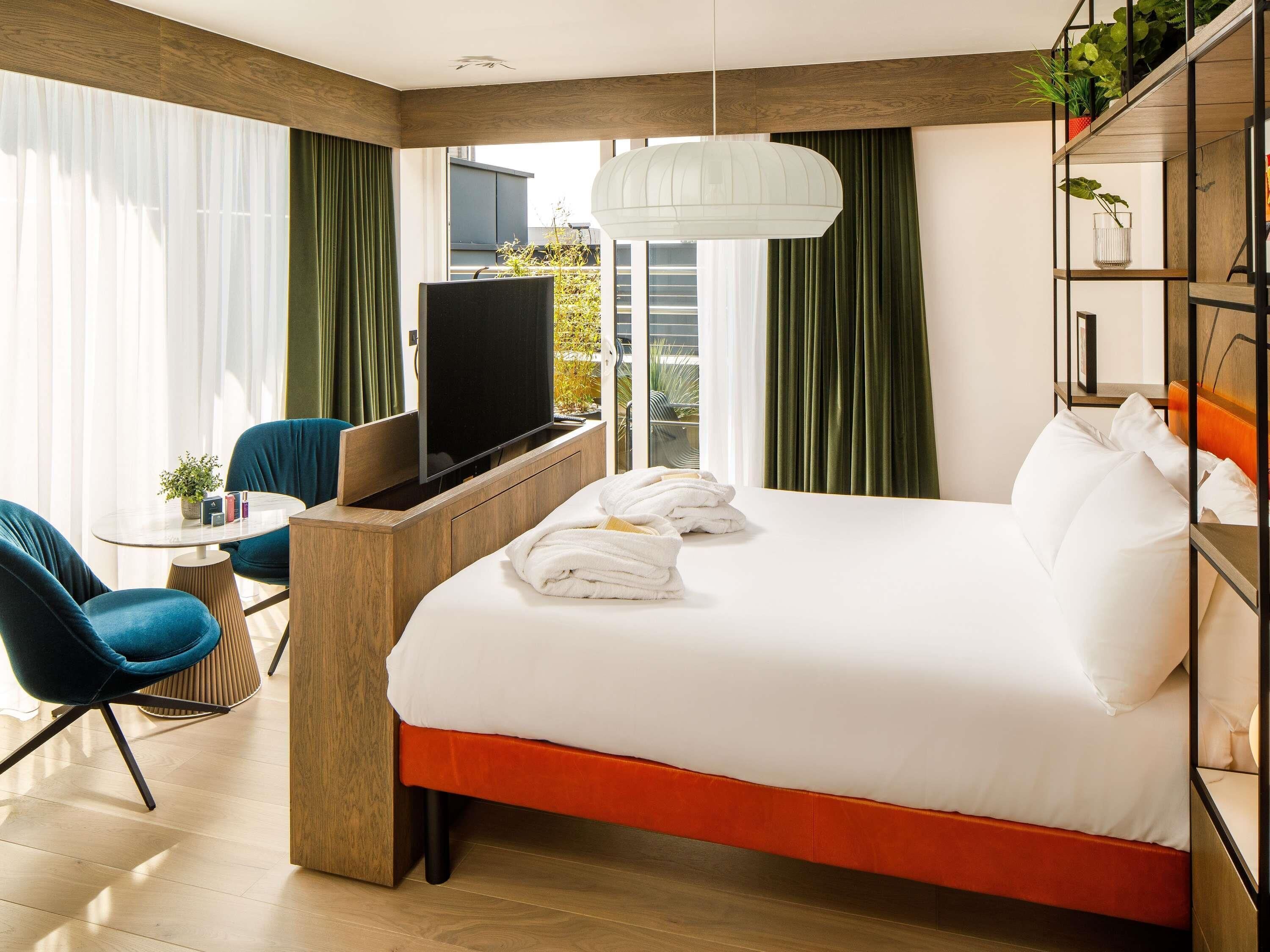 Junior Suite, 1 Double Bed, Balcony | In-room safe, desk, soundproofing, iron/ironing board