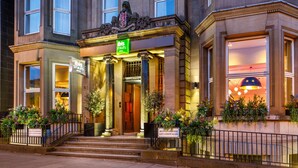 A hotel entrance with a sign for 'Ibis Styles' and a plaque indicating 'Saint Andrew Square'. - ibis Styles Edinburgh Centre St Andrew Square (Edinburgh)