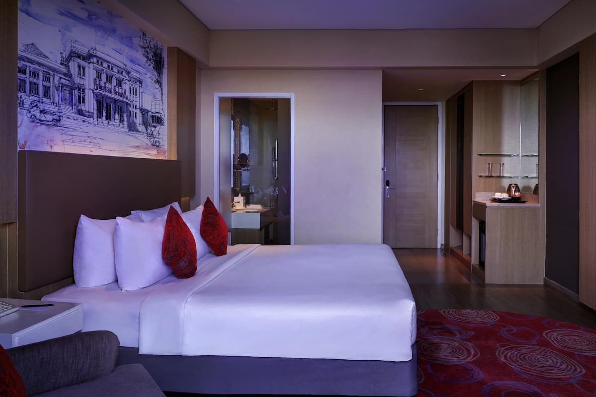 Deluxe Room, 1 Queen Bed, Pool View | 1 bedroom, in-room safe, desk, laptop workspace