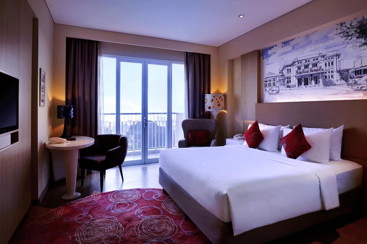 Deluxe Room, 1 Queen Bed, Balcony, Pool View | 1 bedroom, in-room safe, desk, laptop workspace