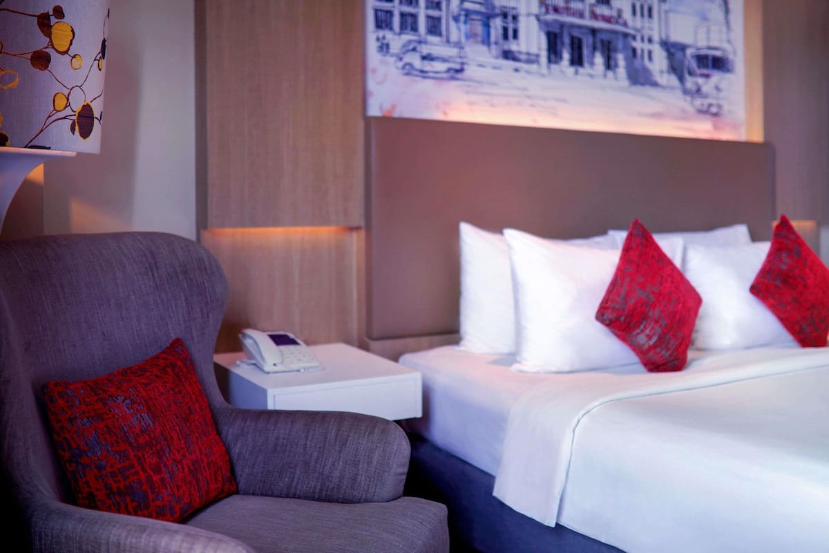 Deluxe Room, 1 Queen Bed, Pool View | In-room safe, desk, laptop workspace, soundproofing