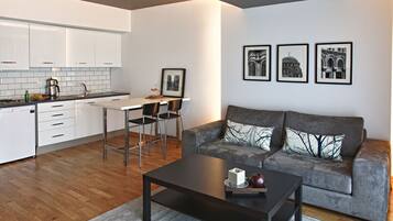 Superior Room | Living area | 40-inch Smart TV with satellite channels, TV