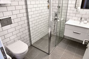 Shower, free toiletries, hair dryer, slippers
