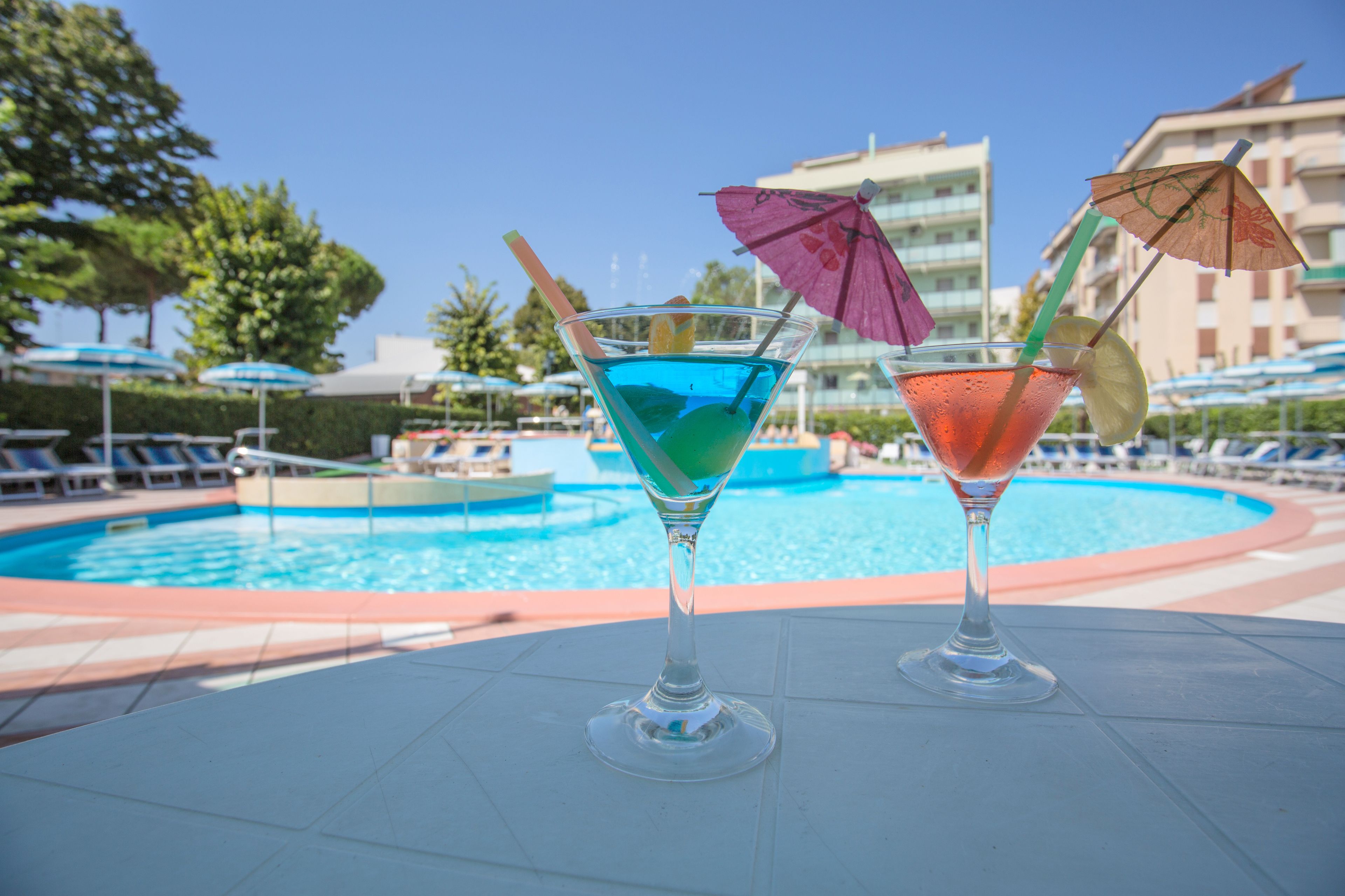 seasonal outdoor pool, pool umbrellas, pool loungers