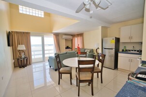 Panoramic Penthouse, 2 Bedrooms, Ocean View | Living area | 32-inch TV with digital channels, streaming services