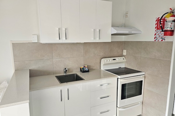 Apartment, 1 Bedroom | Living area | 32-inch TV with satellite channels