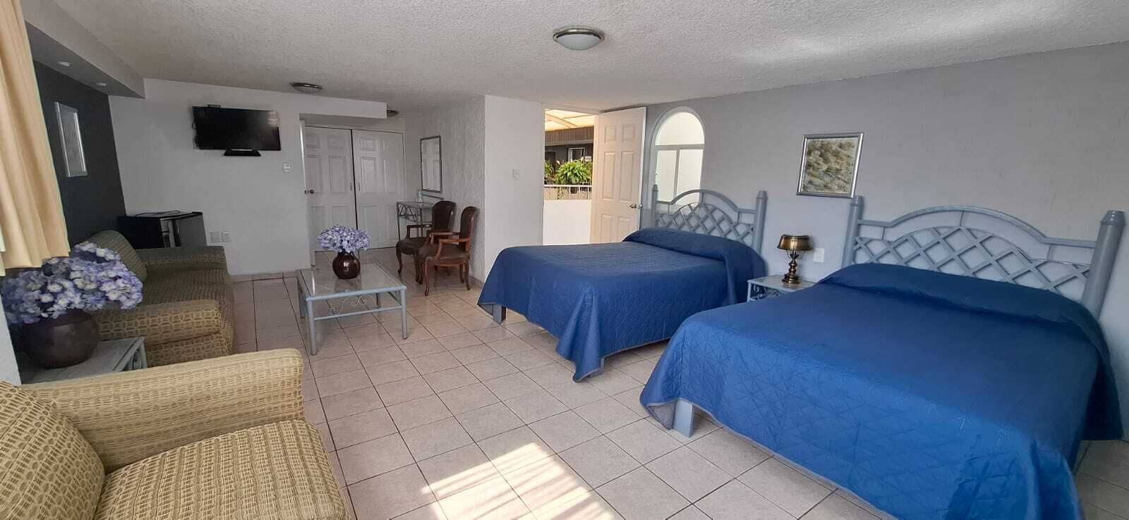 Basic Quadruple Room | Laptop workspace, blackout curtains, iron/ironing board, free WiFi