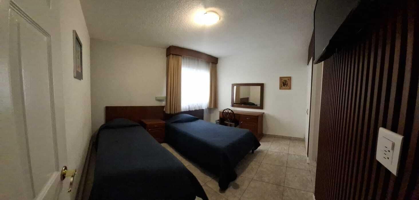 Basic Twin Room | Laptop workspace, blackout curtains, iron/ironing board, free WiFi