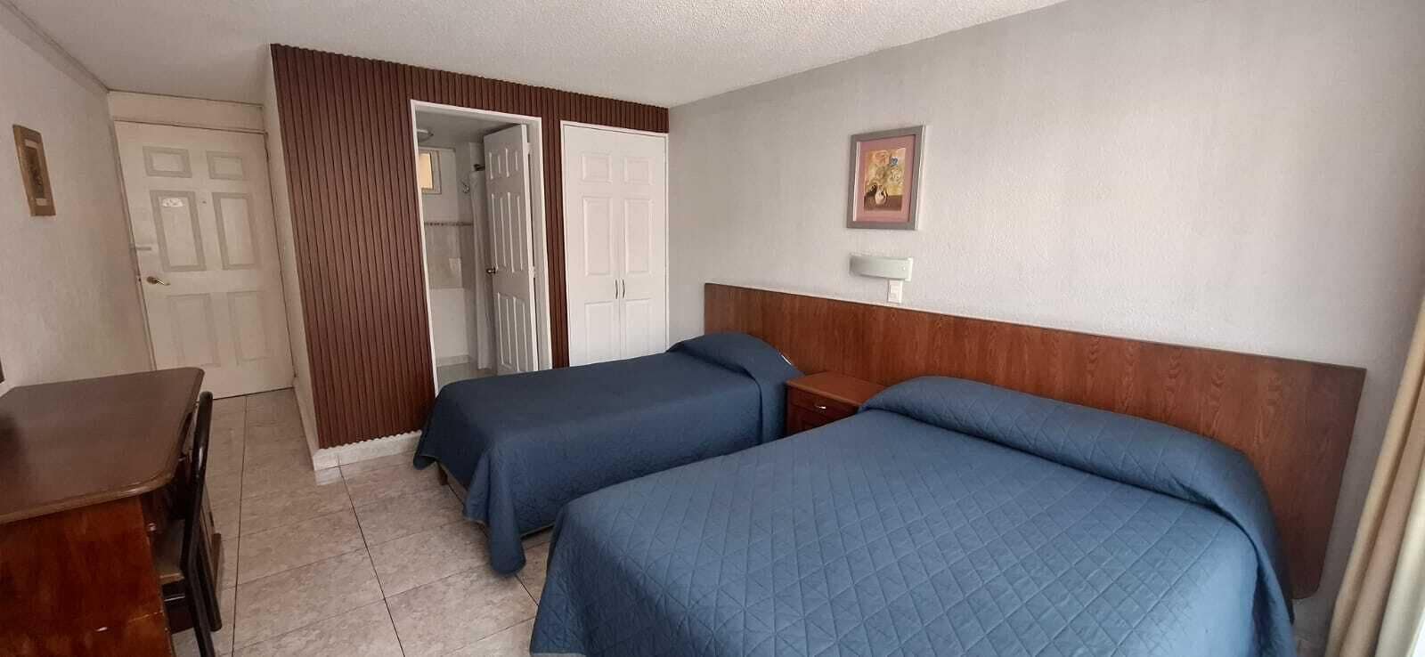 Basic Triple Room | Laptop workspace, blackout curtains, iron/ironing board, free WiFi