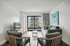 One Bedroom Suite -Ocean View & Balcony | Living area | 50-inch flat-screen TV with digital channels, TV, iPod dock - Bondi 38 Serviced Apartments (Bondi Beach)