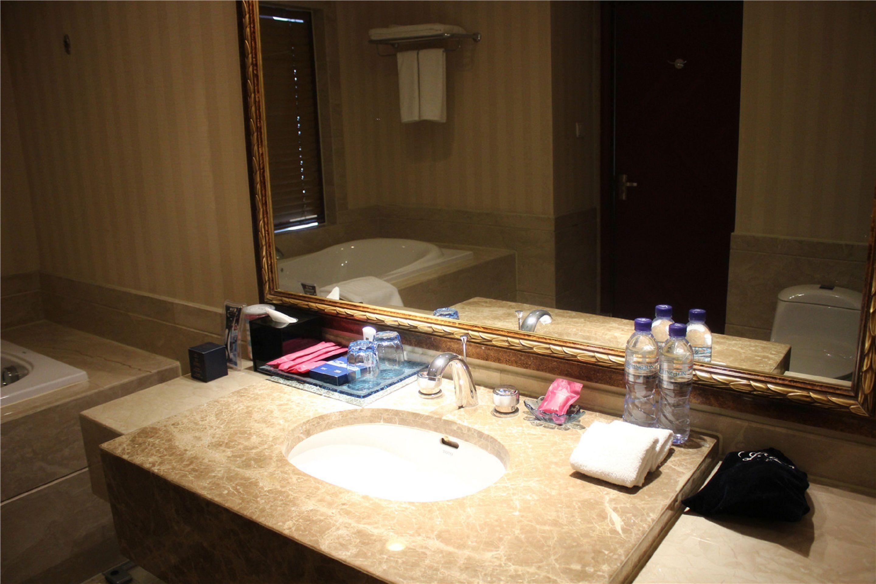 separate bathtub and shower, hair dryer, slippers, towels