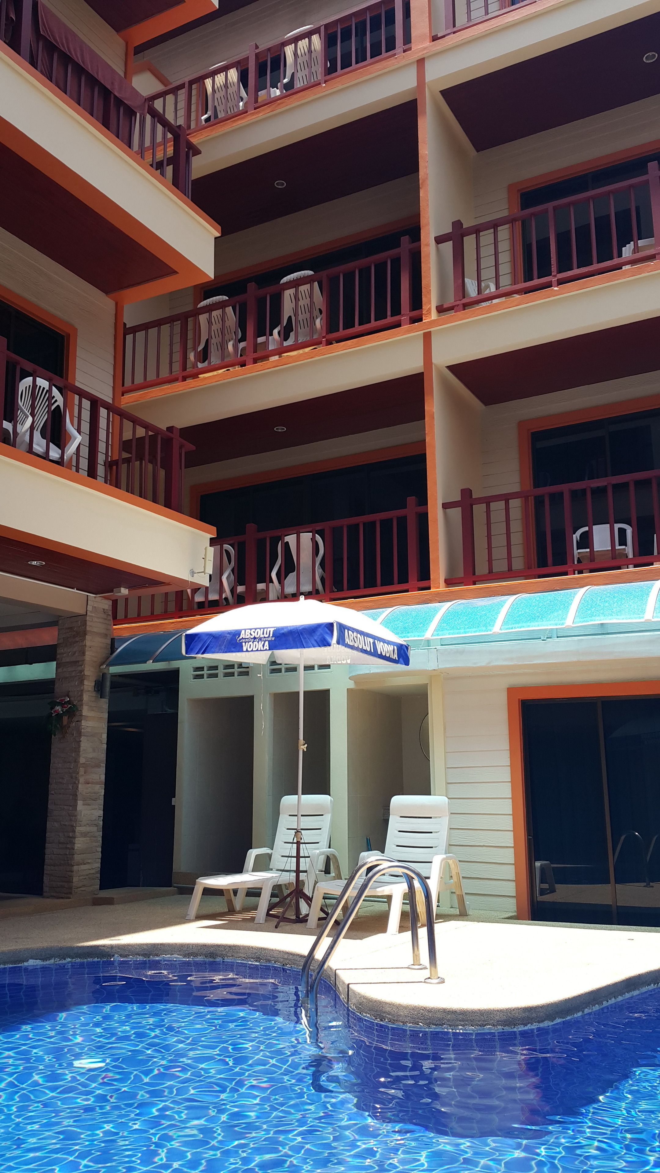 outdoor pool, open 10 am to 8:00 pm, pool umbrellas, pool loungers