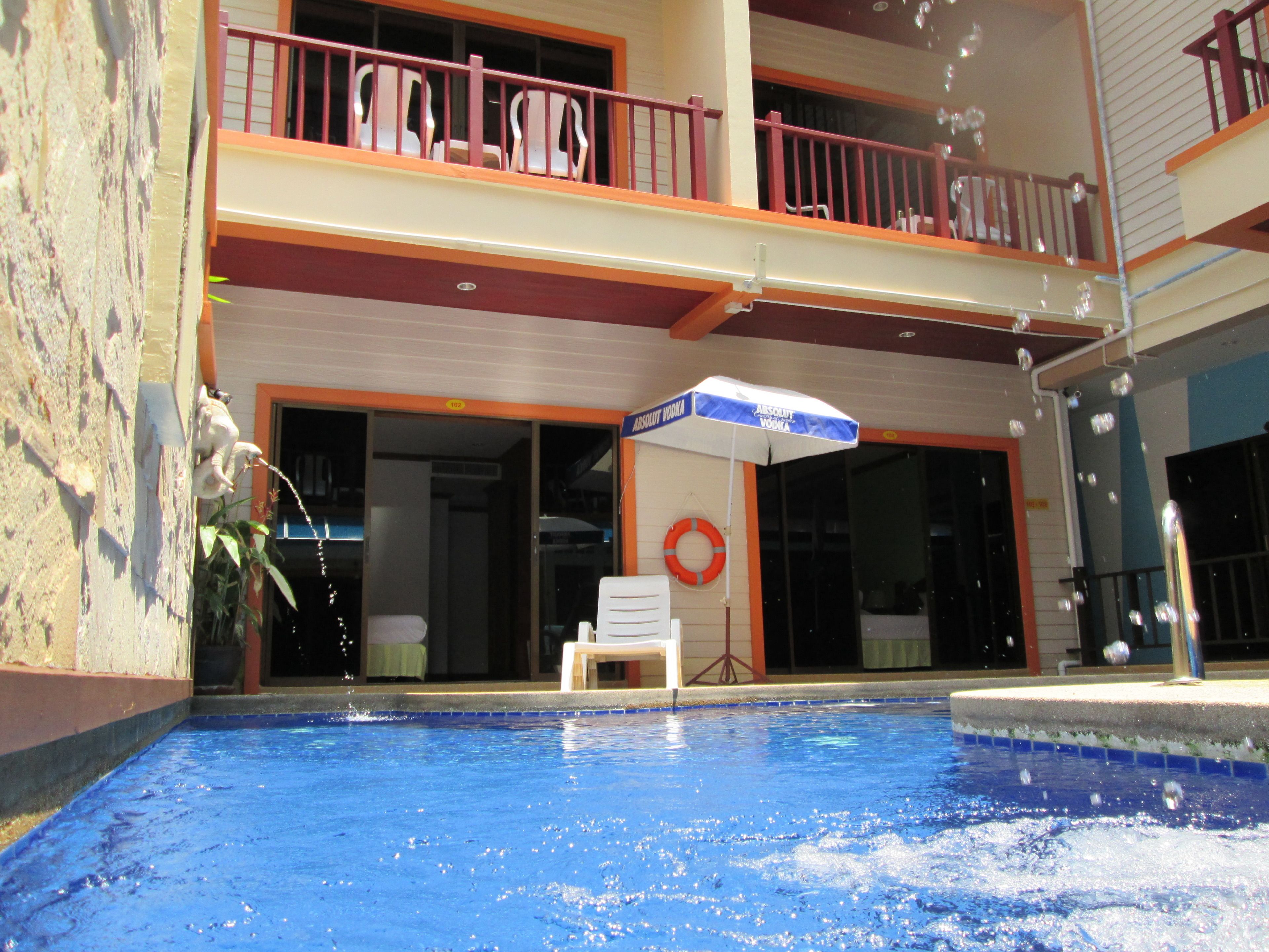 outdoor pool, open 10 am to 8:00 pm, pool umbrellas, pool loungers