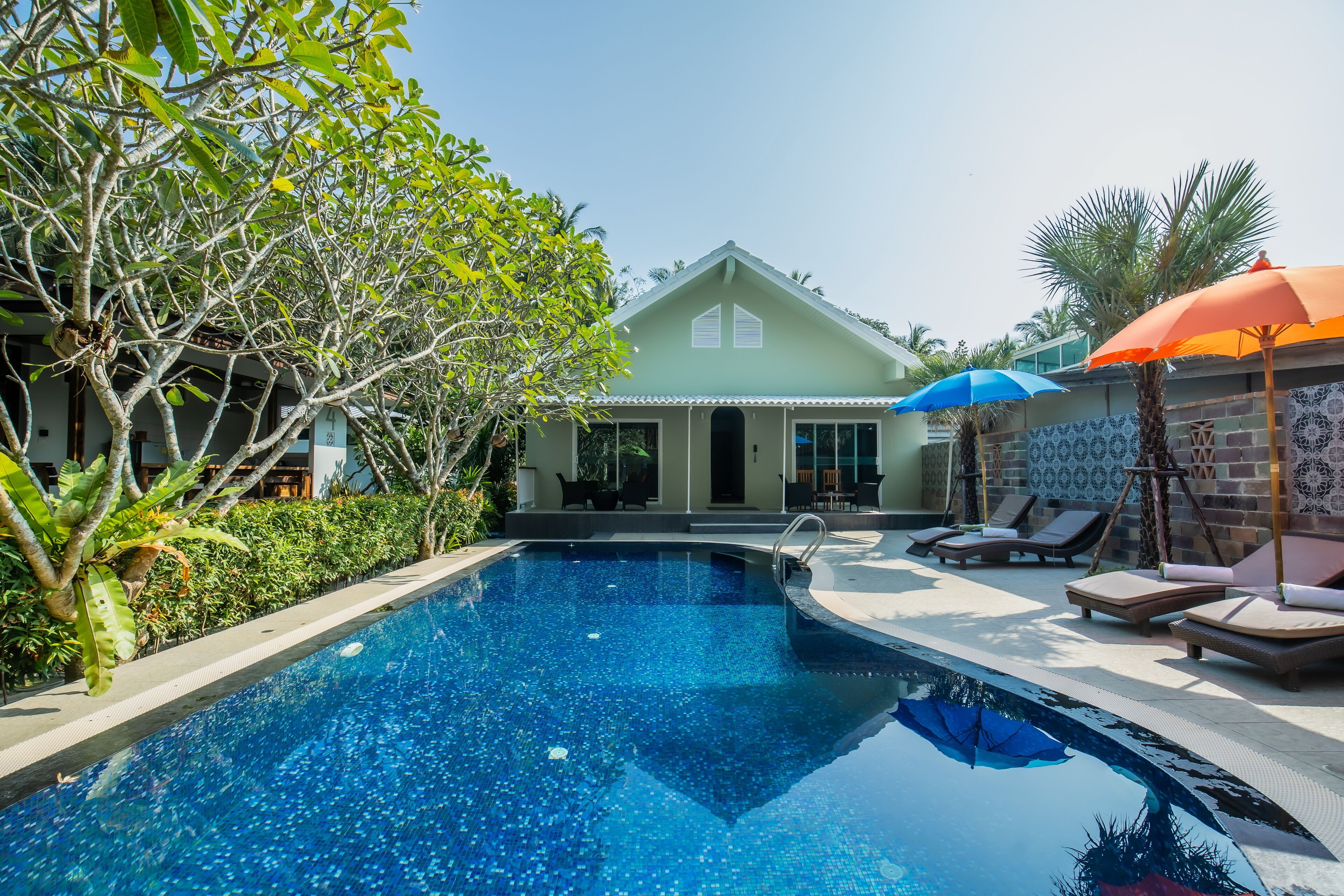 outdoor pool, pool umbrellas, pool loungers