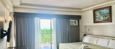 Suite ejecutiva | Ropa de cama hipoalergénica, colchones con acolchado adicional, minibar