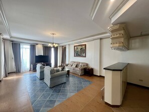 Luxury Penthouse | Living area | TV, computer monitors, printers