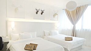 A hotel room with two beds, white bedding, a desk with a chair, and a shower box on each bed. - Creator Hotel (Kulai)